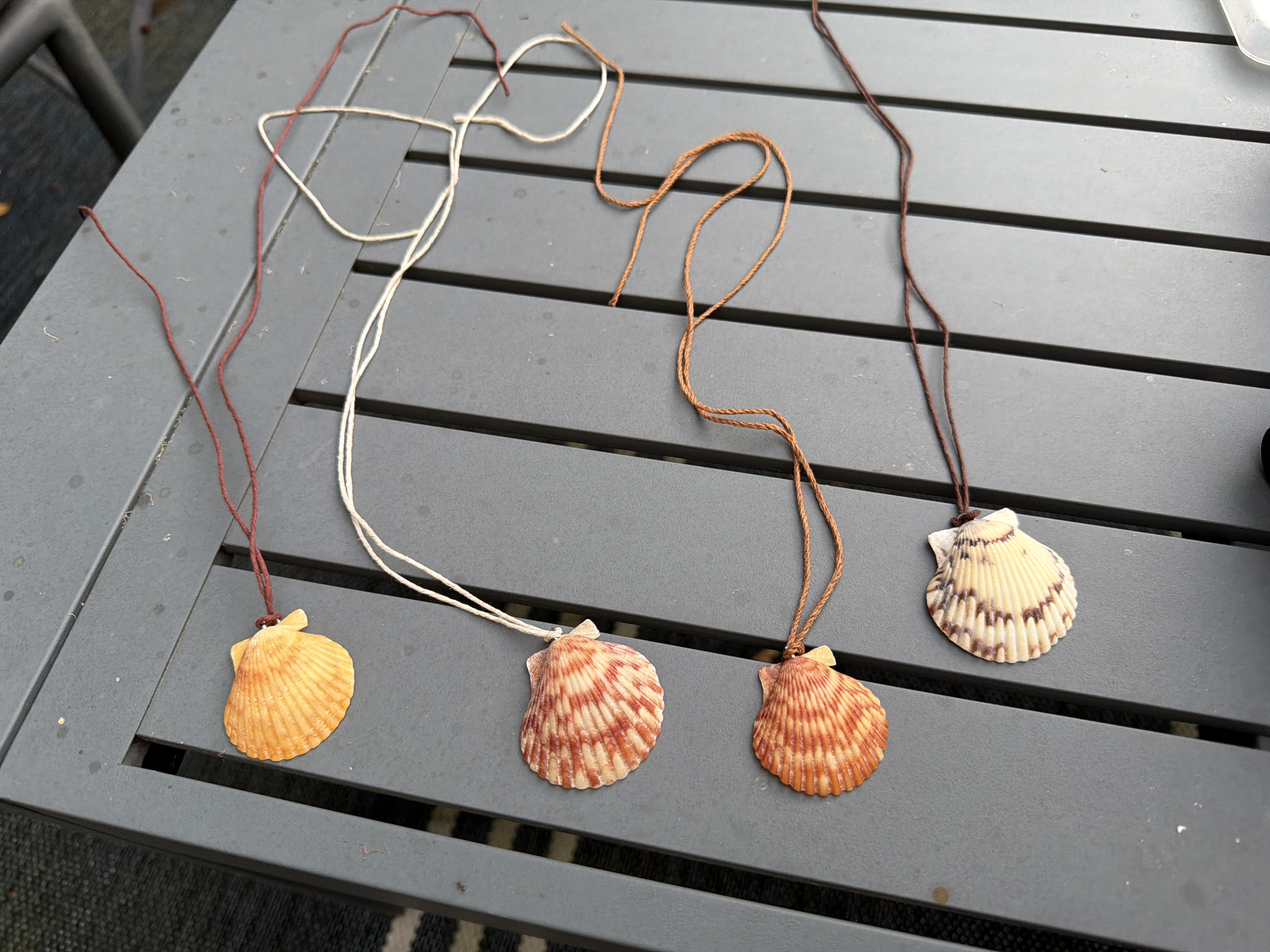 Homemade scallop charms sourced from the Pacific Coast in San Diego County, California. 